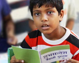 boy-reading-Good-News-Storybook